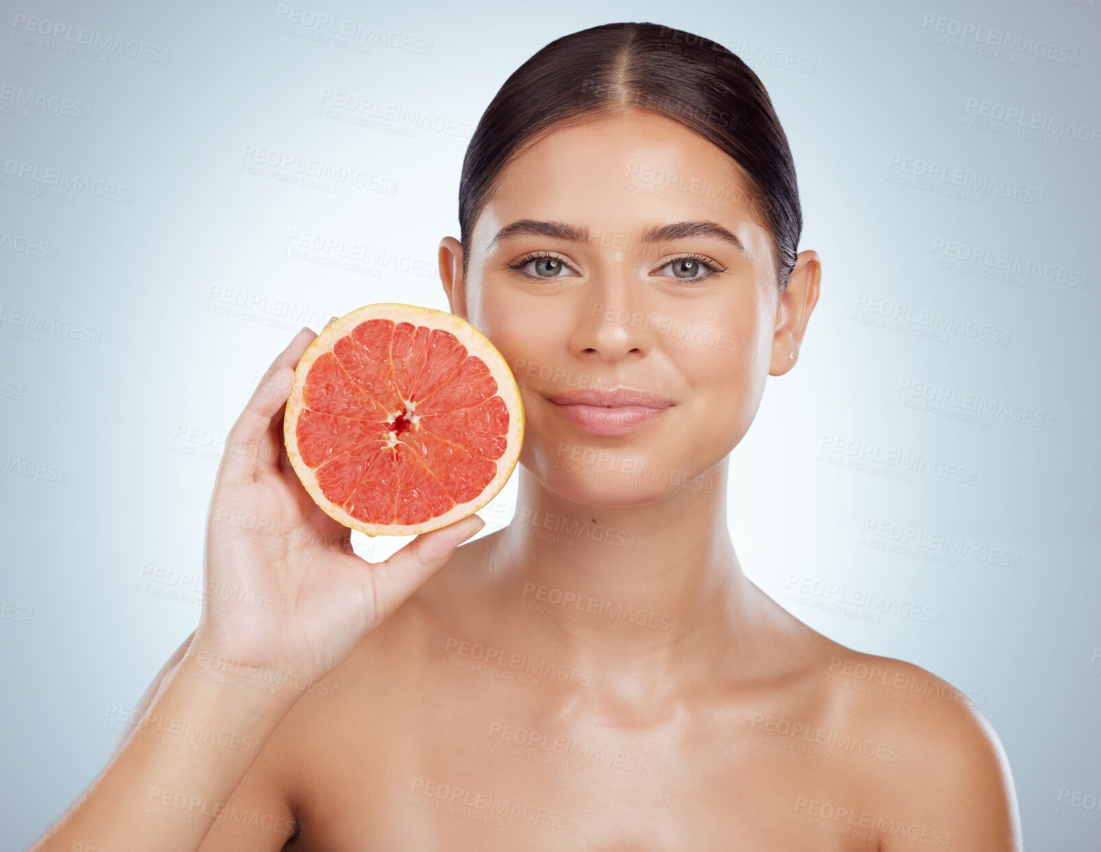 Buy stock photo Skincare, face and woman with grapefruit in studio isolated on a white background. Portrait, natural fruit and female model with vitamin c, nutrition and healthy diet, wellness or beauty cosmetics.