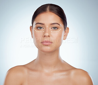 Buy stock photo Portrait of woman with dotted line marking undereye for eyelift surgery. Caucasian model isolated against grey studio background with copyspace posing topless. Young woman ready for cosmetic procedure