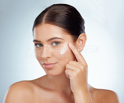 Buy stock photo Face, skincare and beauty of woman with cream in studio isolated on a white background. Portrait, dermatology lotion and female model apply cosmetics, sunscreen or moisturizer product for skin health