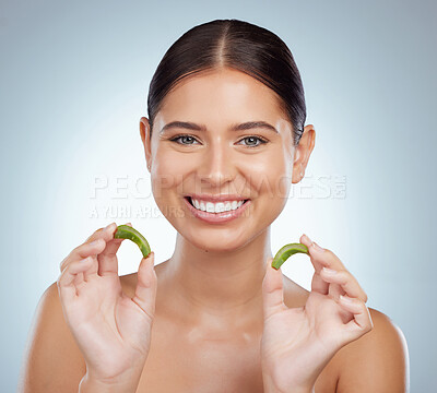 Buy stock photo Portrait of smiling beautiful woman using aloe vera in skincare routine. Caucasian model isolated against grey studio background and posing with copyspace. Organic plants for hydration and moisture