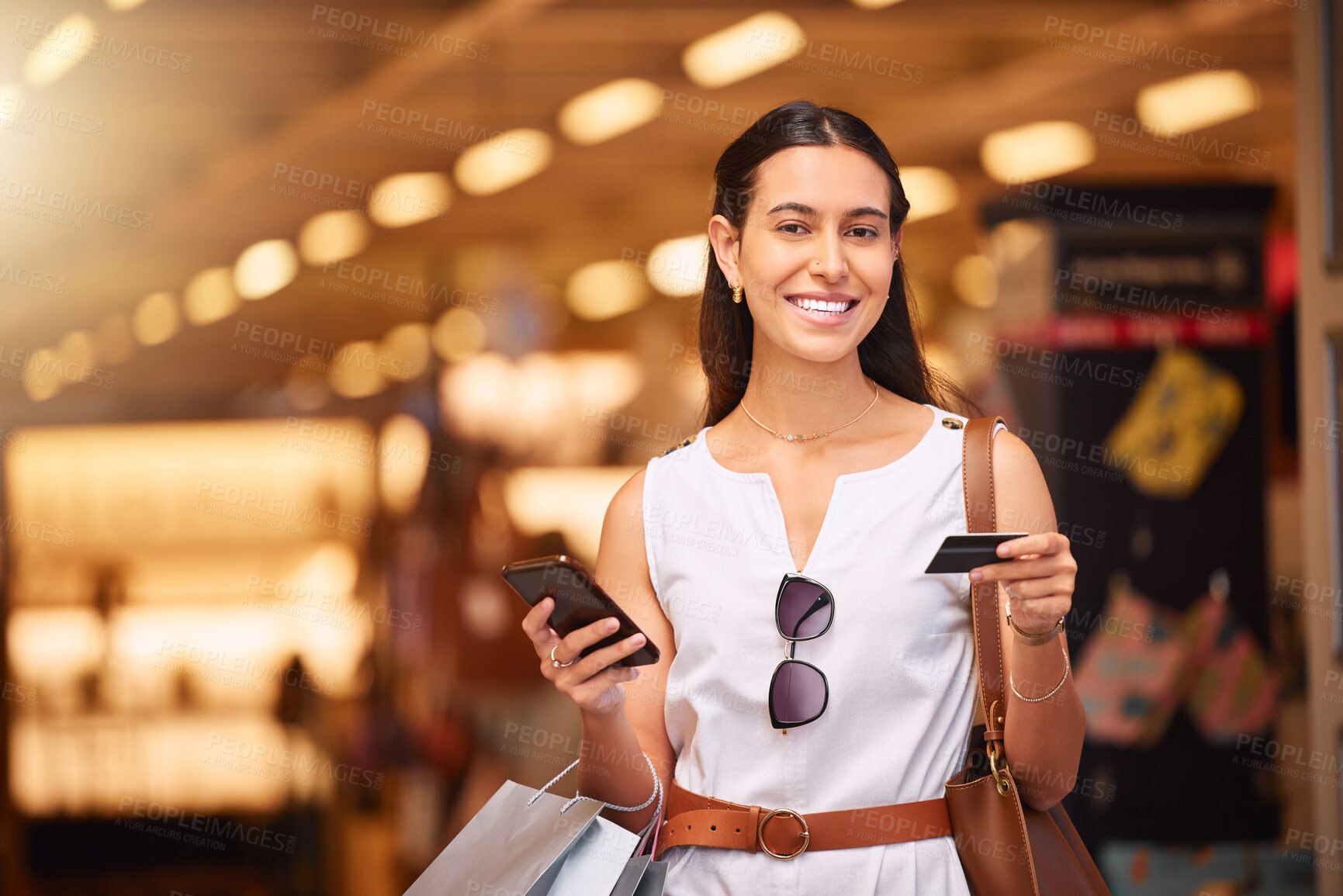 Buy stock photo Phone, credit card and a woman with a shopping bag in mall for fashion, sale or discount deal. Portrait of happy customer person with smartphone for retail promotion offer and online banking app
