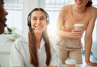 Buy stock photo Group of confident call centre telemarketing agents and operators having a discussion together. Cheerful hispanic woman drinking coffee while talking to her colleagues during a break in an office