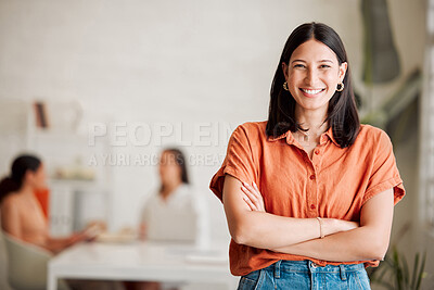 Buy stock photo Portrait of one confident young hispanic business woman standing with arms crossed in an office with her colleagues in the background. Ambitious entrepreneur and determined leader ready for success in a creative startup agency