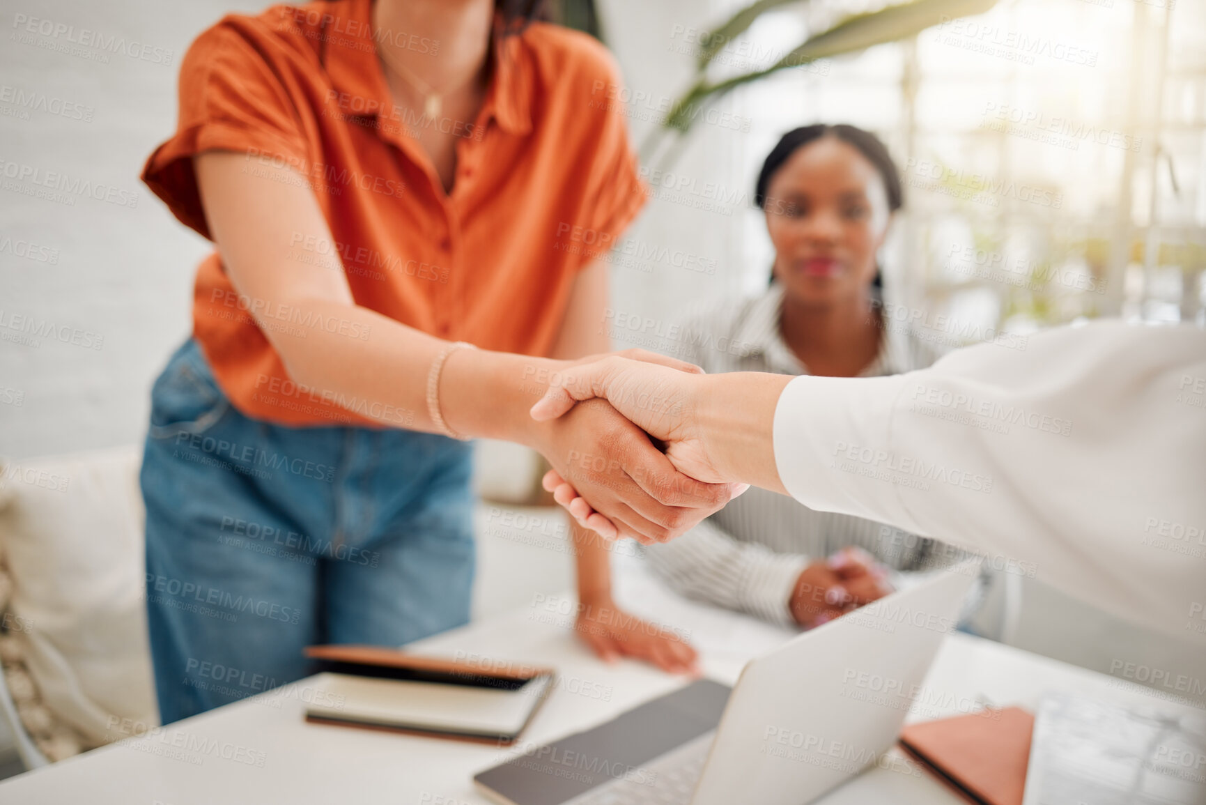 Buy stock photo Businesswomen shaking hands in the office for a deal, partnership or corporate collaboration. Meeting, welcome and closeup of female employees with a handshake for an onboarding, hiring or agreement.
