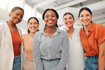 Buy stock photo Portrait of a diverse group of five happy businesswomen standing together in a boardroom at work. Cheerful businesspeople standing in an office. Women working in corporate standing together