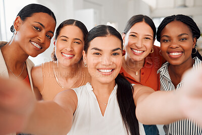 Buy stock photo Portrait of a diverse group of five happy businesswomen taking a selfie together at work. Cheerful businesspeople taking a photo in an office. Women working in corporate taking a picture
