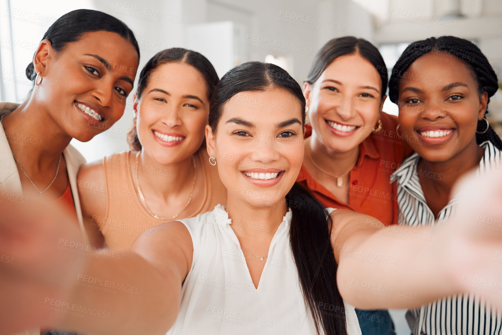 Buy stock photo Portrait of a diverse group of five happy businesswomen taking a selfie together at work. Cheerful businesspeople taking a photo in an office. Women working in corporate taking a picture