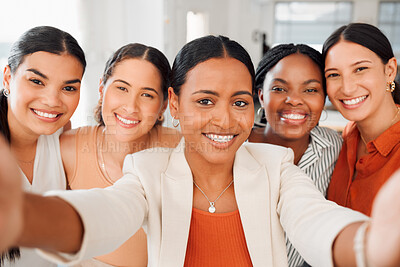 Buy stock photo Portrait of a diverse group of five happy businesswomen taking a selfie together at work. Joyful businesspeople taking a photo in an office. Women working in corporate taking a picture