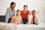 Portrait of a group of happy diverse businesswomen having a meeting together in a boardroom at work. Cheerful businesspeople talking and planning in a workshop in an office