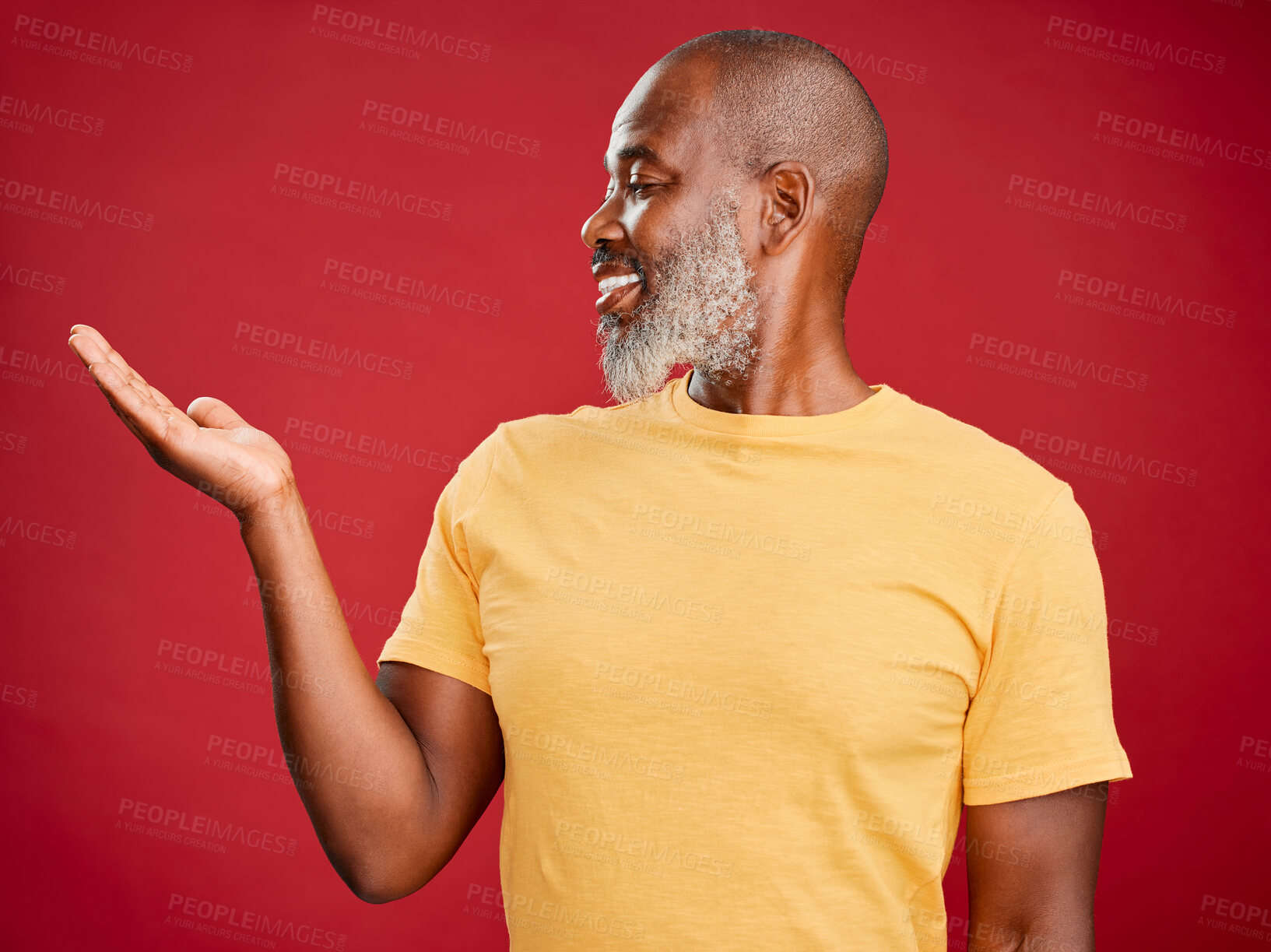 Buy stock photo Mature african american man with a beard smiling looking happy and making a hand gesture standing against a red studio background. Happy, smiling, showing
