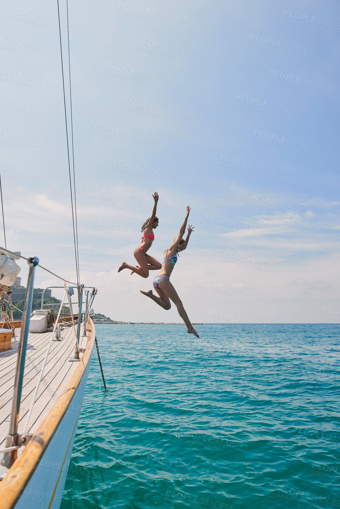 Buy stock photo Summer, sailing and friends jumping off a yacht together into the ocean for freedom, fun or swimming. Travel, energy and bikini with girls leaving a boat to jump into the sea while on a luxury cruise