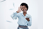 A happy young african american businesswoman throwing cash in the air celebrating her wealth and profit against a white background. Young african female enjoying the success of her business. Money is what happens when you do everything else right
