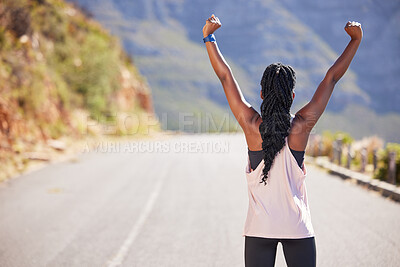 Buy stock photo Active woman from the back cheering with arms outstretched outdoors. Proud athlete celebrating victory and accomplishment after run or jog. Inspired and motivated to reach fitness and wellness goals