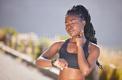 Buy stock photo One beautiful young african american woman checking her pulse while exercising outdoors. A fit and sporty female athlete checking her heart rate on a smart watch during a workout. Counting the beats