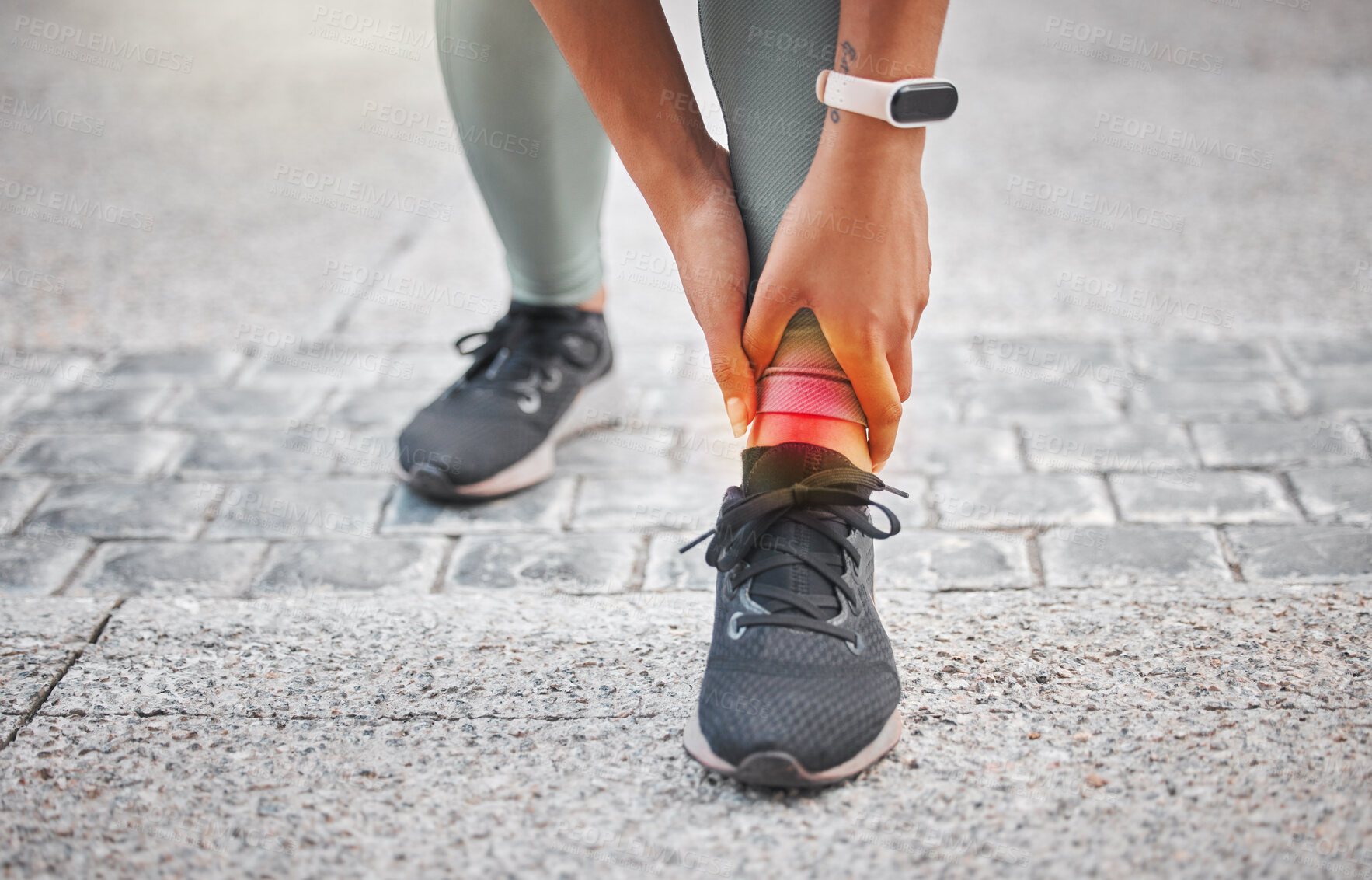 Buy stock photo Close up of a active woman with ankle twist or sprain injury during a workout or while running outdoors. Woman wearing smart watch and holding her leg in pain after hurting her ankle during exercise
