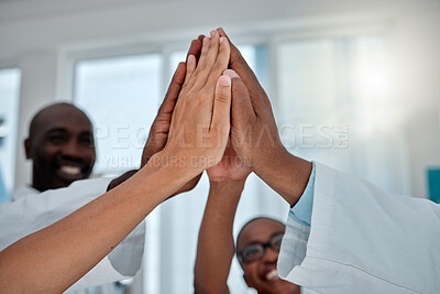Buy stock photo Group, doctors and high five in hospital, teamwork and solidarity with women, men and support for healthcare. Doctor, team and people with motivation, medical collaboration and diversity in clinic