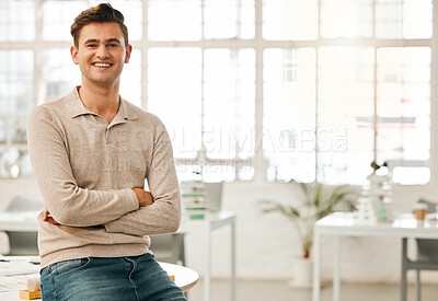 Buy stock photo Proud businessman sitting on his desk. Confident businessman in his office. Young architect in his design office. Creative entrepreneur working in his office. Portrait of happy businessman