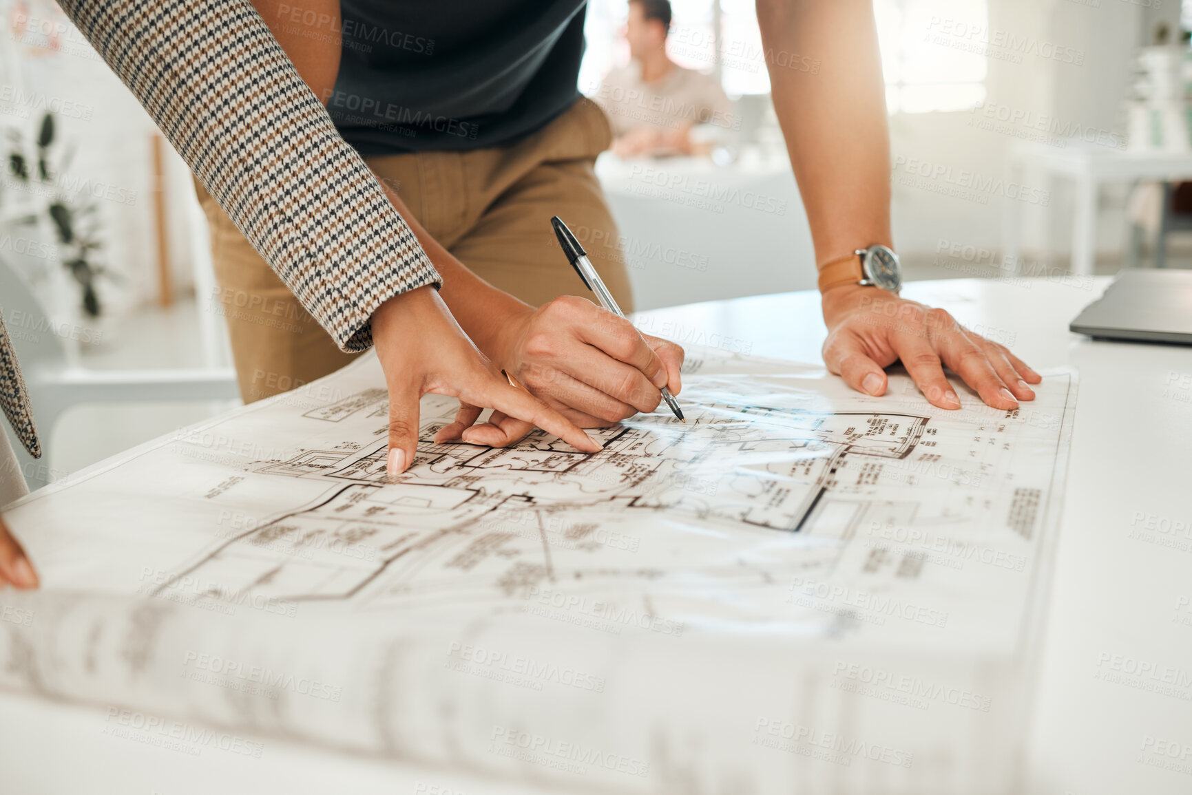 Buy stock photo Businesspeople working on building plan together. Hands of colleagues writing on a blueprint. Two architects collaborate on a blueprint. Closeup of engineers planning a building together.