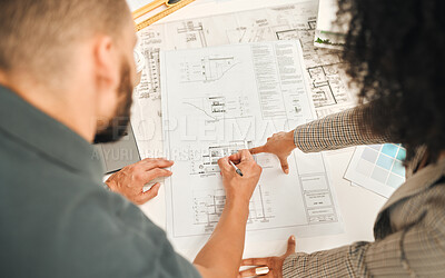 Buy stock photo Architects working on a blueprint from above. Businesspeople writing on a building plan. Coworkers working on architect plan. Businessman working with a businesswoman in his office.