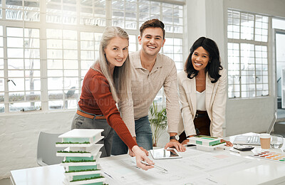 Buy stock photo Portrait of happy businesspeople together. Diverse businesspeople planning a building together. Colleagues working on a blueprint. Corporate designers using a tablet in a meeting.
