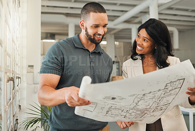 Buy stock photo Happy colleagues talking about blueprint. African american businesswoman talking to coworker about building plan. Engineers holding a blueprint. Businesspeople collaborate on a blueprint