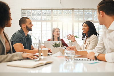 Buy stock photo Diverse businesspeople brainstorm during a meeting. Architects planning their strategy. Businesspeople collaborate in an agency. African american businesswoman talking to colleagues