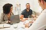 Happy businesspeople collaborate in a meeting. Young businesspeople working together in an agency. Group of architects brainstorm in a meeting. Businesspeople working architecture agency