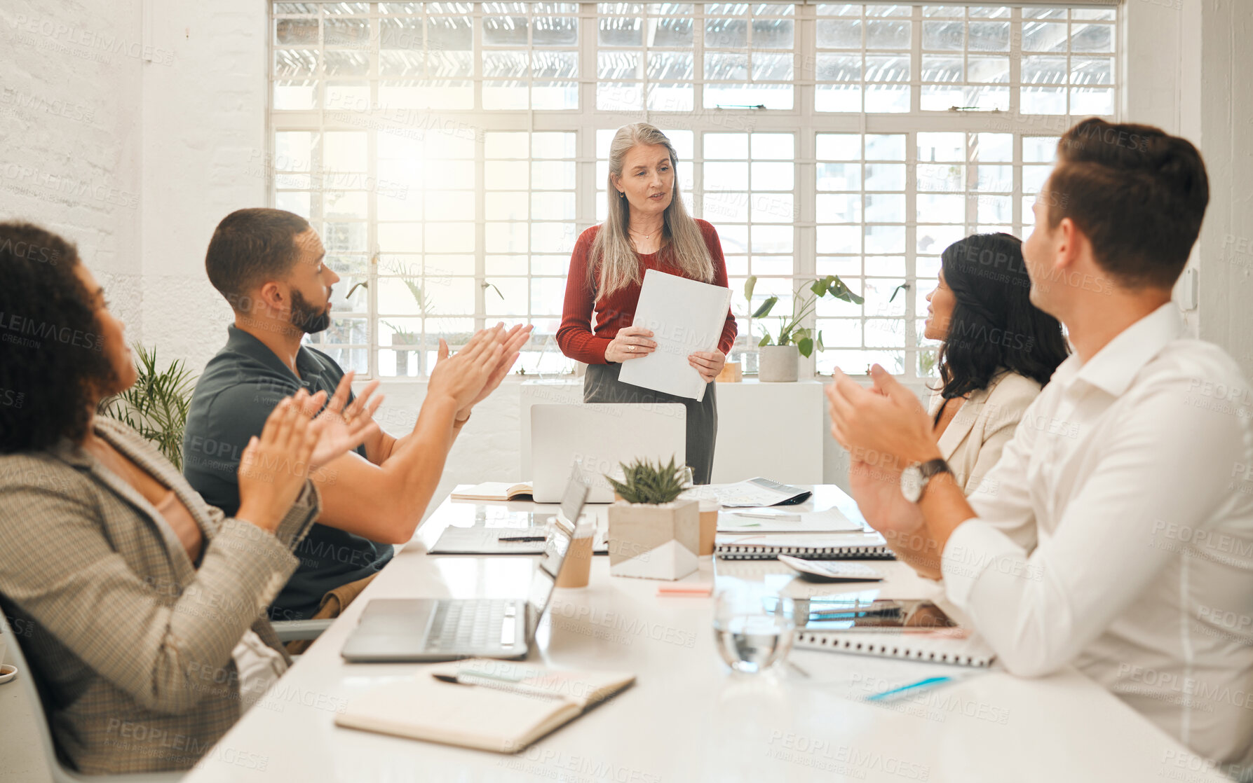 Buy stock photo Diverse businesspeople clapping during a meeting. Group of a businesspeople congratulating their boss. Powerful,leading businesswoman in a meeting. Diverse businesspeopl giving their boss applause