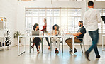 Group of businesspeople working in an office. Diverse group of businesspeople in a office. Diverse architects working together. Businesswomen talking and working together