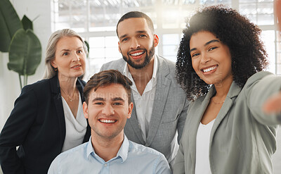 Buy stock photo Portrait of a group of cheerful diverse businesspeople taking a selfie together at work. Happy mixed race businesswoman taking a photo with her joyful colleagues