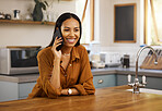 Young cheerful mixed race woman talking on the phone while relaxing at home alone. One hispanic female in her 20s on a call using her cellphone at home