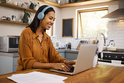 Buy stock photo Home, remote work and business woman on laptop for research project, strategy and planning in kitchen. Freelancer, smile and girl with headphones for music with documents, computer and working online