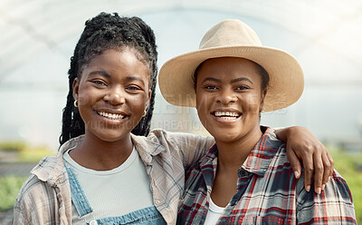 Buy stock photo Faces of happy farm workers. Portrait of smiling colleagues in a greenhouse. African american farmers working in agriculture. Two women standing in their garden together.