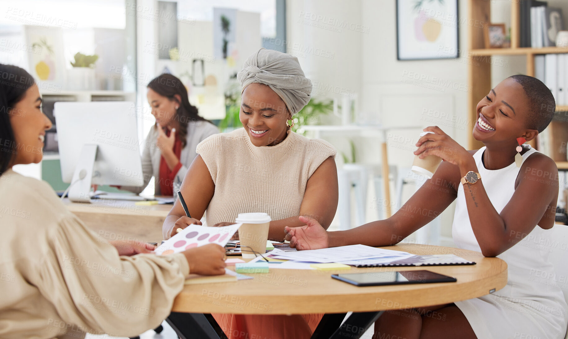 Buy stock photo Diverse group of smiling business women planning a brainstorm meeting in office. Happy confident professional team sitting together and using paperwork, talking and cooperation on marketing strategy