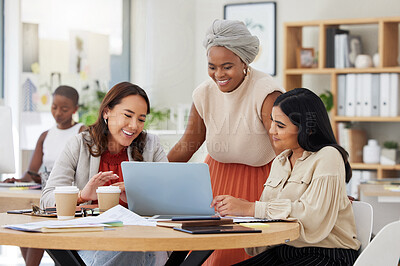 Buy stock photo Diverse group of smiling business women using a laptop for a brainstorm meeting in an office. Happy confident professional team of colleagues using technology to talk and planning a marketing strategy