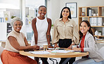 Portrait of diverse group of young ethnic business women having a brainstorm meeting in office. Ambitious confident professional team of colleagues talking and planning a marketing strategy together