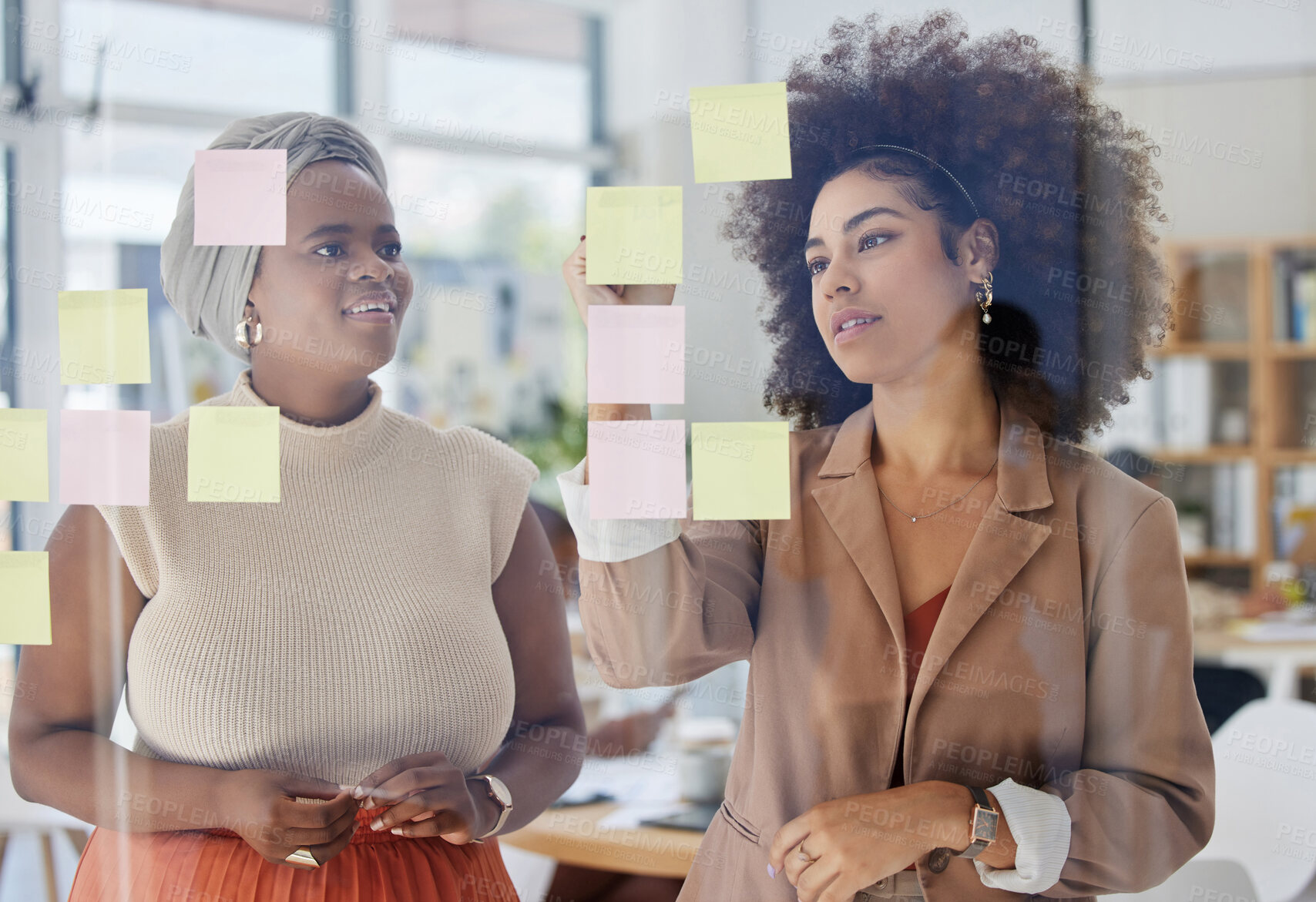 Buy stock photo Team, brainstorming and business people with glass board, writing ideas on sticky note with collaboration and strategy. Planning, meeting and women working together, female employees and partnership