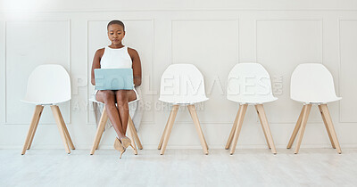 Buy stock photo Laptop, black woman and waiting room chair for job interview, recruitment or hiring. Computer, hr and serious business person typing or African female sitting in office for employment in workplace.