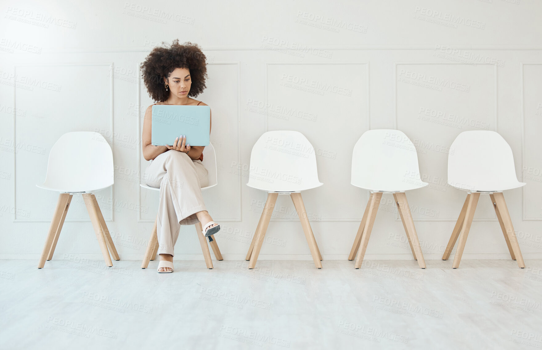 Buy stock photo Recruitment, laptop and woman in waiting room for interview, hiring or job opportunity in office. Computer, hr and business person typing online while sitting on chair for employment in workplace.