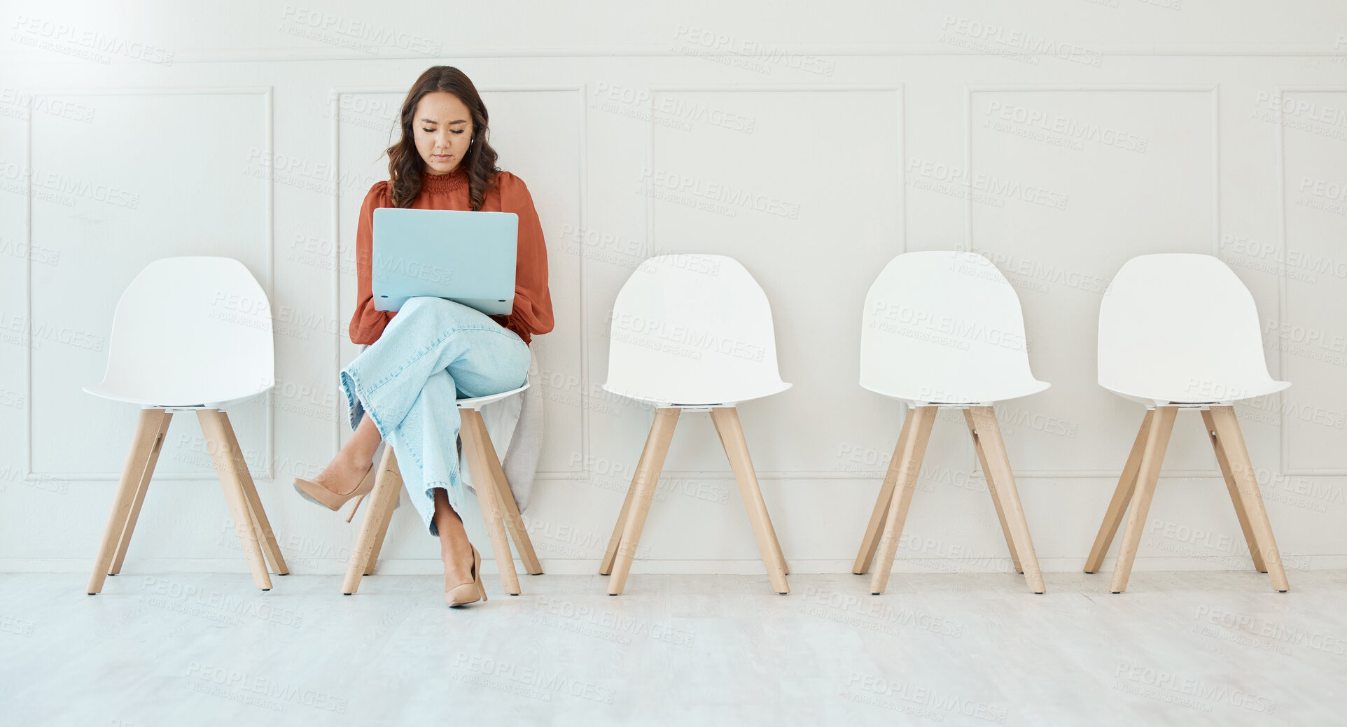 Buy stock photo Waiting room, sitting and a woman with a laptop for email, preparation and interview research. Office, working and corporate employee with a computer for internet, recruitment planning and browsing