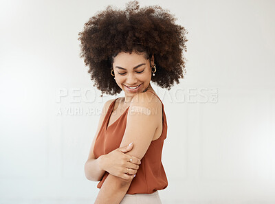 Buy stock photo Covid plaster, arm and smile of black woman in studio for injection with medical insurance. African female happy on a white background with healthcare vaccine, safety compliance and mockup space