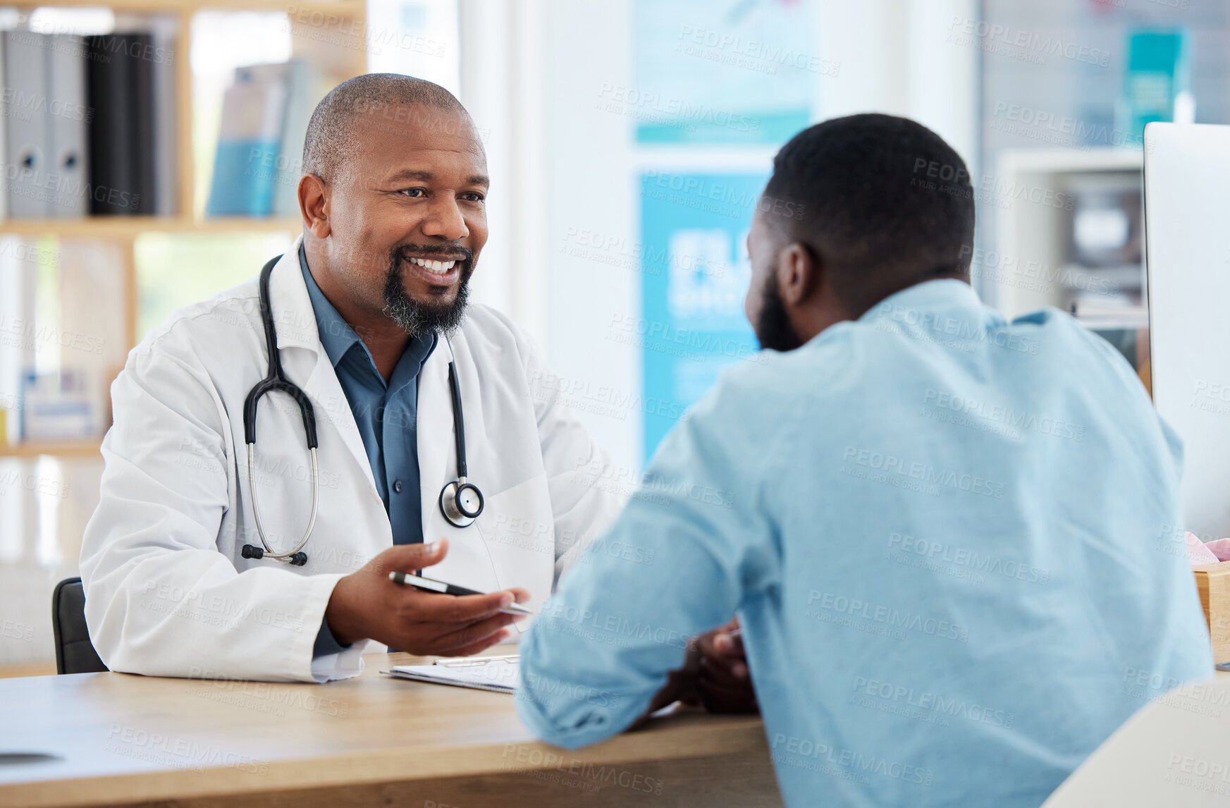 Buy stock photo Happy, talking and doctor with a black man for healthcare, support and advice on treatment. Smile, consulting and an African gp with a patient speaking about medicine, health and professional help