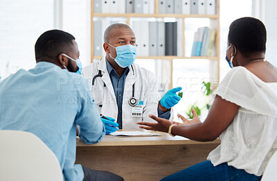 Buy stock photo Covid, health and doctor consulting a black couple in a hospital for wellness, insurance or treatment. Medical, healthcare or trust with a medicine professional talking to a man and woman in a clinic
