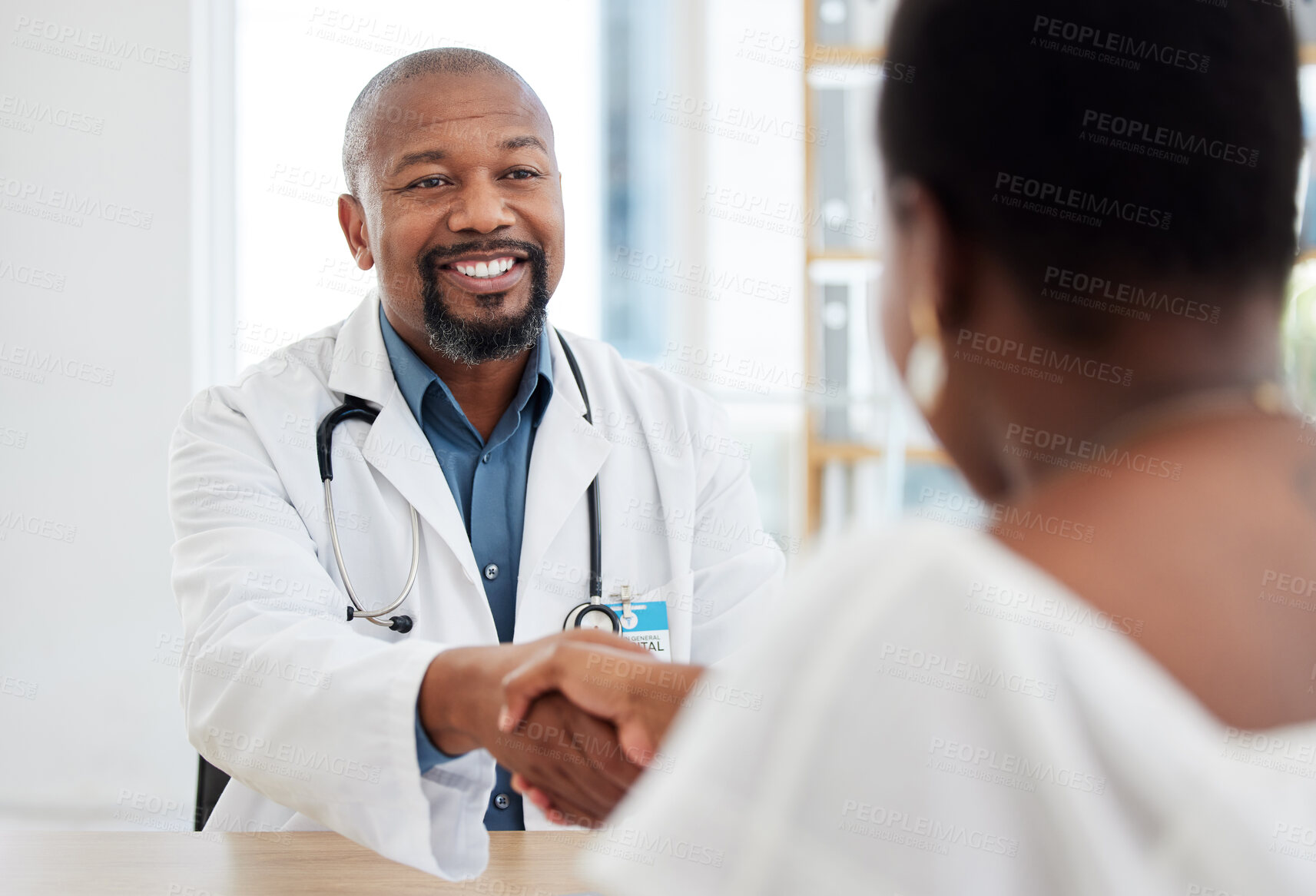 Buy stock photo Happy doctor, patient and handshake in healthcare visit, consultation or agreement at hospital. Black man, medical professional shaking hands with woman client for consulting, checkup or appointment