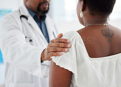 Doctor touching a patient on the shoulder in support. Closeup on hand of doctor being kind to a patient in a checkup. Medical gp offering a patient comfort during a consult cropped.
