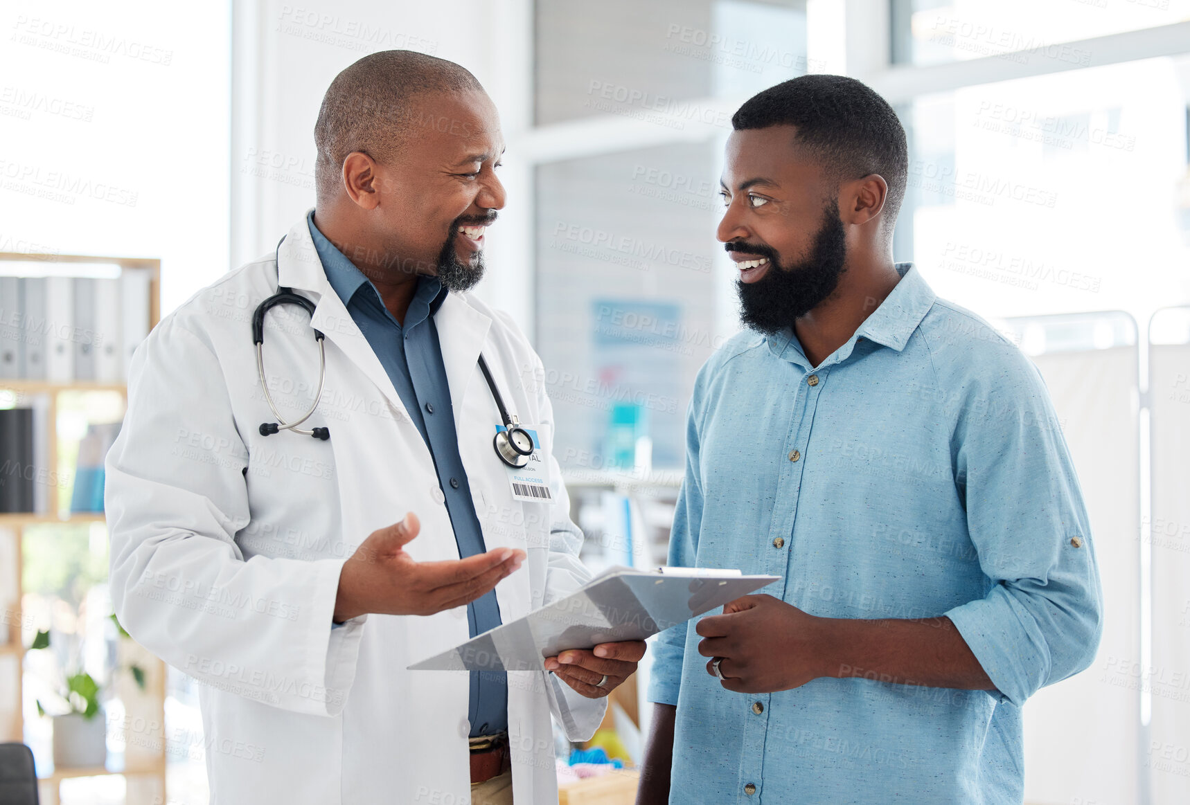 Buy stock photo Doctor, black man and patient with clipboard in consultation, talking or health results in hospital. Healthcare, paperwork and happy medical professional with mature person with checklist in clinic.