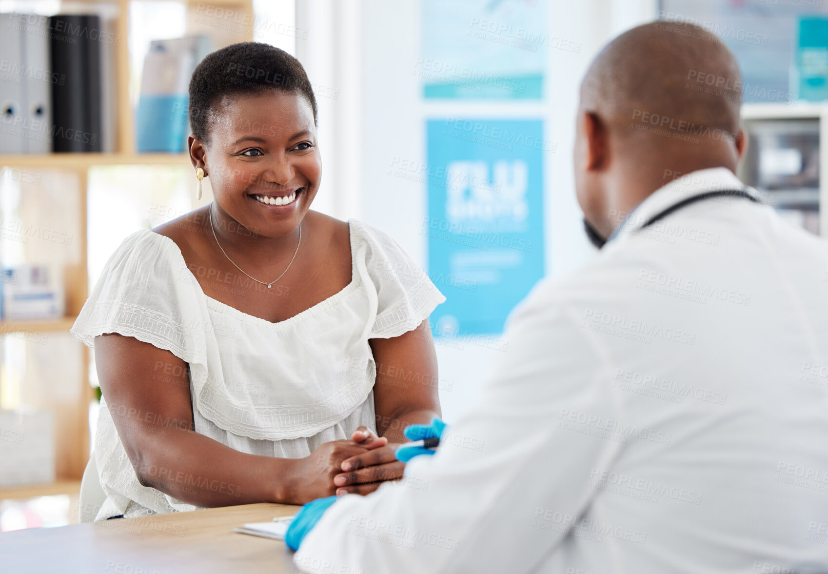 Buy stock photo Doctor, black woman and healthcare consultation with a wellness and hospital worker in office. Consulting, patient and happy female with smile from health communication and expert advice in a clinic