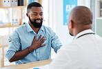 Young man in a consult with his gp. African american patient talking to doctor about chest pain. Medical professional in a checkup with his patient. Patient in treatment for chest pain