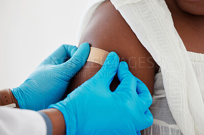 Buy stock photo Vaccination, plaster and doctor helping patient with injection or medical vaccine in hospital. Consultation, appointment and hands closeup of healthcare worker putting arm bandage on woman in clinic