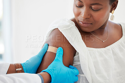Buy stock photo Healthcare, plaster and doctor helping a patient after an injection or vaccine in the hospital. Consultation, appointment and hands of medical worker putting a bandaid on a woman in a medicare clinic